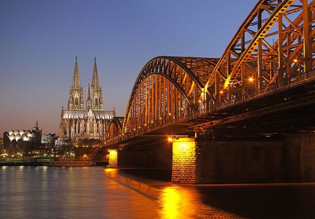 Hohenzollernbrücke in Cologne (Germany) with Cologne Cathedral in the blue hour   Photo Credit