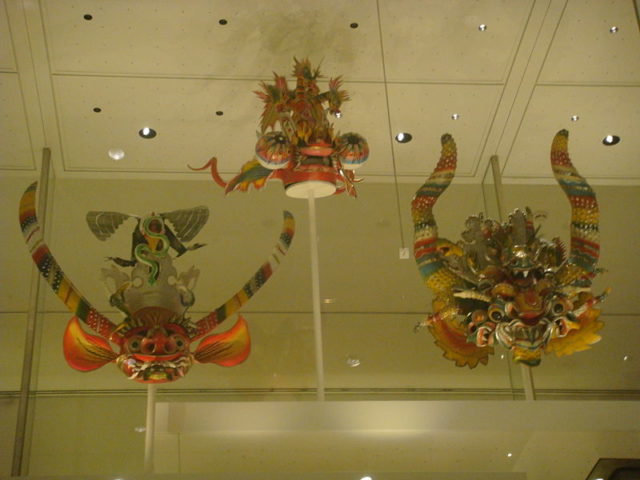 Different models of Diablada masks in an exhibition in the British Museum. Photo credit