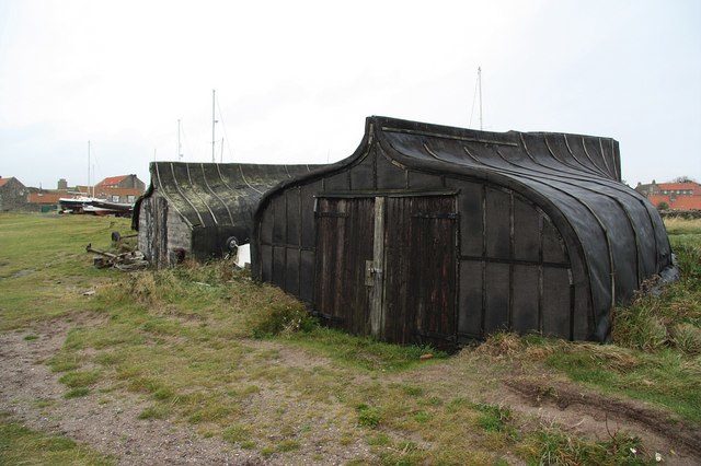 Boat huts. Archetypal images of Holy Island, upturned boat keels recycled as fisherman’s huts. Photo Credit