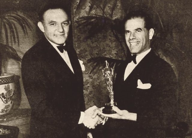 Frank Capra receiving a Best Director Academy Award in 1938.