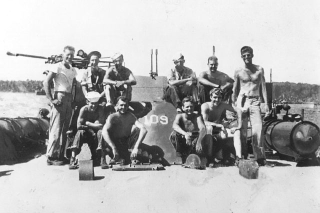 Lieutenant John F. Kennedy, USNR (standing at right). PT-109 was commanded by Kennedy with one executive officer and 10 enlisted men on the night it was struck by the Japanese destroyer.