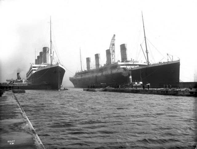March 6, 1912: Titanic (right) had to be moved out of the drydock so her sister Olympic (left), which had lost a propeller, could have it replaced.
