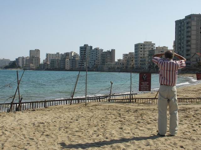 A man standing outside of the military fence near Varosha. Photo Credit