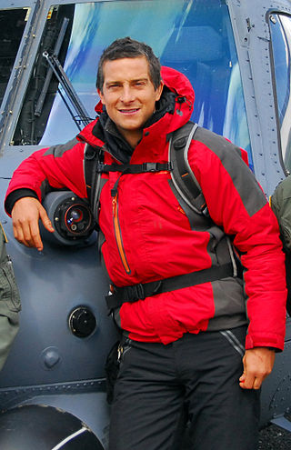 Bear Grylls in front of an Alaska Air National Guard, 210th Rescue Squadron HH-60 Pave Hawk helicopter before heading out to Spencer Glacier to film Man vs. Wild (Born Survivor)