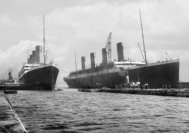 Belfast, Northern Ireland, March 6, 1912: Titanic (right) moved out of the drydock to allow her sister Olympic to replace a damaged propeller blade. Photo credit