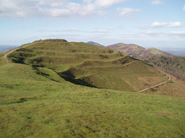 The central mound of the hillfort at British camp, viewed from the south. The layered earthwork defenses can be seen clearly.