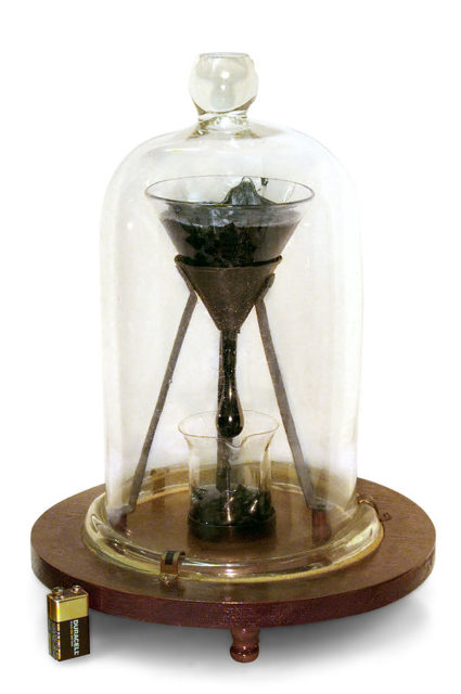 The University of Queensland “Pitch Drop Experiment’, demonstrating the viscosity of bitumen. – By the University of Queensland & John Mainstone – CC BY-SA 3.0