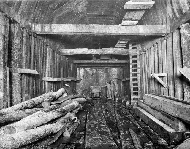 The Garrison Tunnel in the process of timbering and bench mucking. June 27, 1911 Author New York Public Library