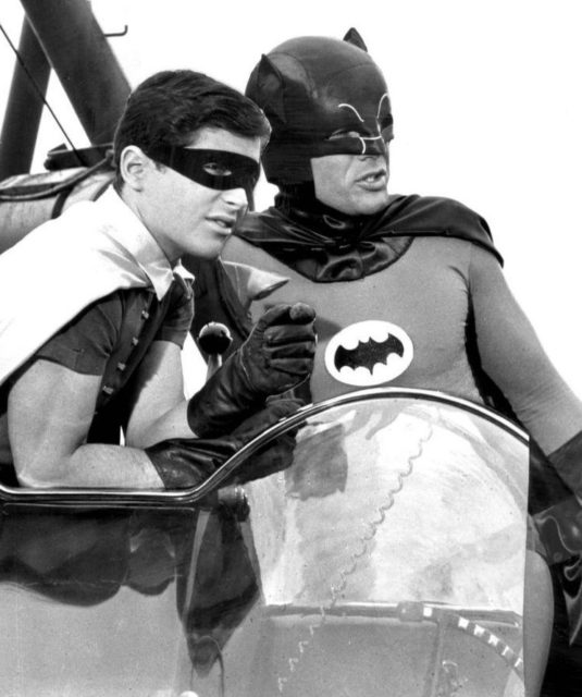 Batman and Robin, with their gadgets.