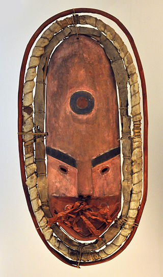 Wooden mask, fur, feather, leaf and stalks, 57 cm, Kuskokwim Bay, 1930s