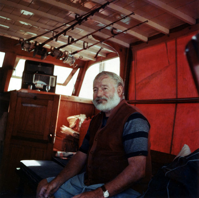 Hemingway in the cabin of his boat Pilar, off the coast of Cuba.