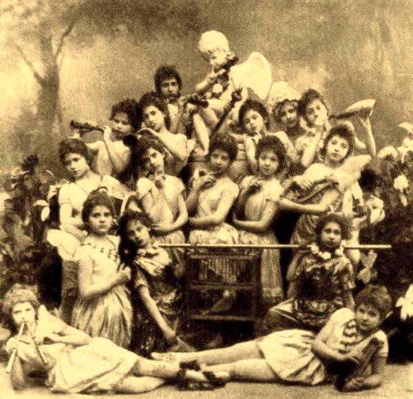 Students of the Imperial Ballet School in Marius Petipa’s “Un conte de fées.” A 10-year-old Anna Pavlova participated in this work in her first ever ballet performance. She is photographed here on the left holding the birdcage. St. Petersburg, 1891.