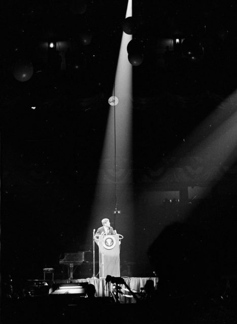 John F Kennedy speach in Madison square garden 1962. Photo by Cecil Stoughton. White House Photographs. John F. Kennedy Presidential Library and Museum, Boston”White House Photographs – JFK Library website