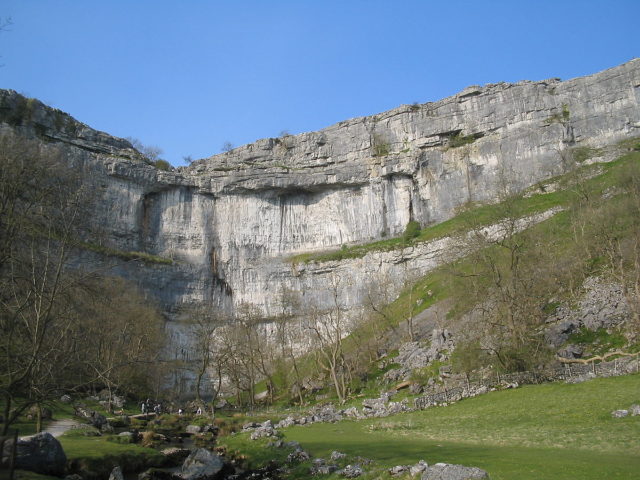 Malham Cove as seen from the bottom of the cliff, Photo by David Benbennick, CC BY-SA 3.0