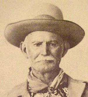 Brushy Bill Roberts, who claimed to be the notorious outlaw Billy the Kid–here wearing mustaches well as a wide-brimmed hat, neck scarf, and coat. Source: Fair use