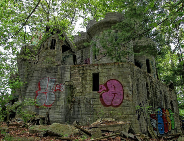 Vandals also left their mark on the deteriorating structures, By Forsaken Fotos, CC BY 2.0 / Flickr