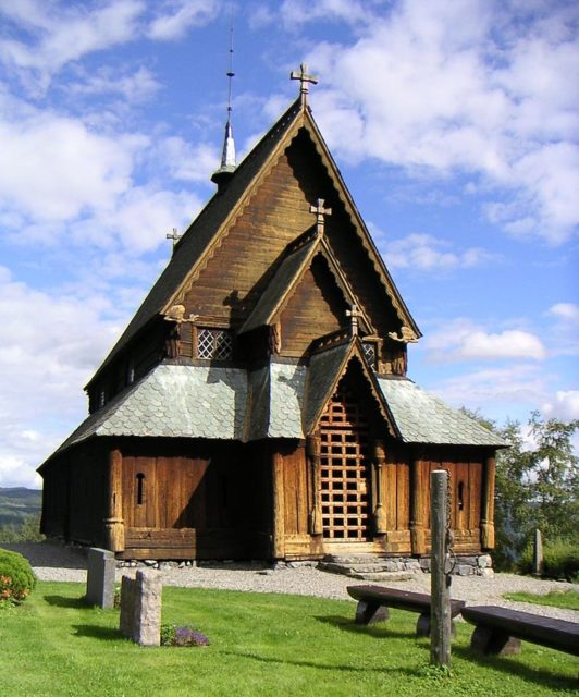 Reinli stave church with the old pillory, Sør-Aurdal Author: Tor Svensson CC BY-SA 2.5
