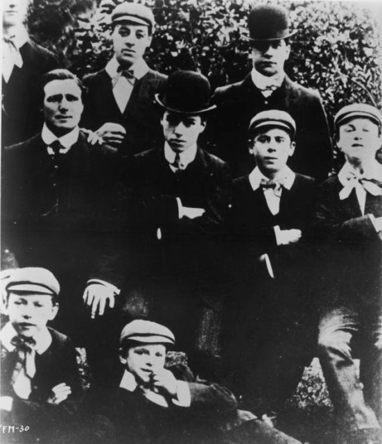 Image of the vaudeville troupe Casey’s Court Circus, with a young Charlie Chaplin in the middle.