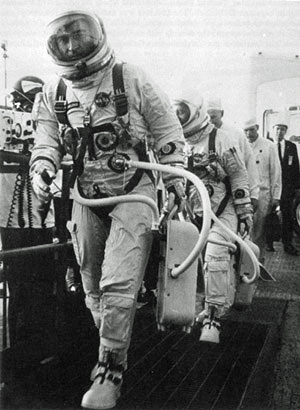 Astronauts Young and Grissom walk up the ramp leading to the elevator that will carry them to the spacecraft for the first manned Gemini mission. They are wearing Gemini G3C intra-vehicular suits.