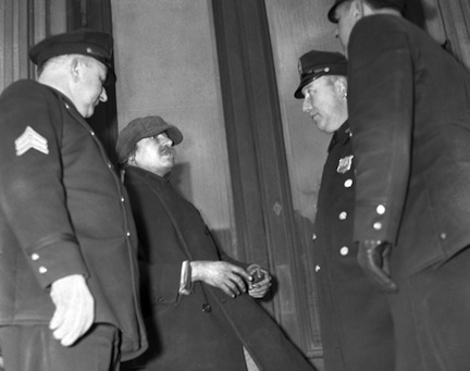 Homer Collyer of New York, arguing with police officers, 1939. Author Tom Watson. Fair use