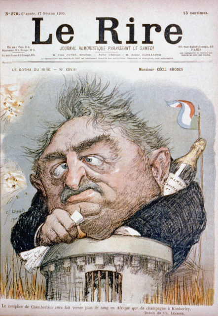 French caricature of Rhodes, showing him trapped in Kimberley during the Second Boer War, seen emerging from tower clutching papers with champagne bottle behind his collar.