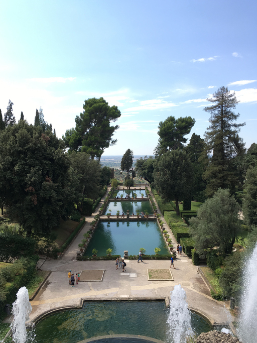 Tivoli, Italy – 9 September 2016: View of the long rectangular fish ponds (Peschiere) below The Fountain of Neptune at Villa d’Este, UNESCO World Heritage Site, 16th Century Italian villa.