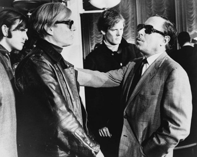 Warhol (left) and Tennessee Williams (right) talking on the SS France, 1967.