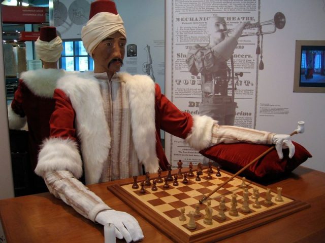 The Turk – Mechanical Turk or Automaton Chess Player (German: Schachtürke), exposed in Heinz Nixdorf MuseumsForum, Paderborn, Germany. Author: Marcin Wichary CC BY 2.0