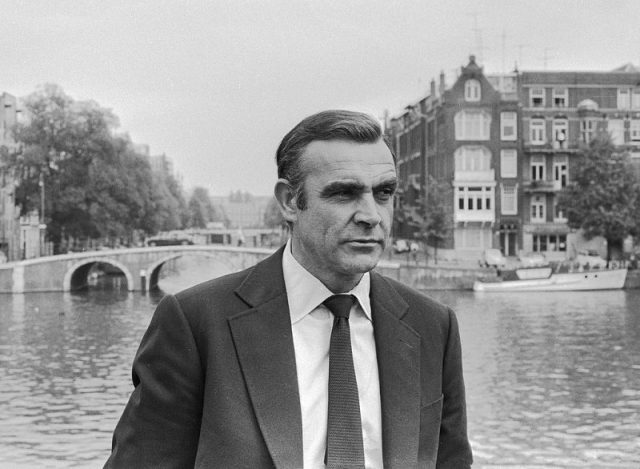 Sean Connery starred as 007 in the first five Bond films: “Dr. No” (1962), “From Russia with Love” (1963), “Goldfinger” (1964), “Thunderball” (1965), and “You Only Live Twice” (1967). He appeared again as Bond in “Diamonds Are Forever” (1971) and “Never Say Never Again” (1983). Photo Credit Dutch National Archives,CC BY-SA 3.0 nl