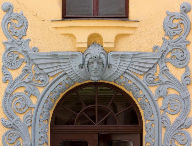 RIGA, Latvia – July 18, 2013: Bas-relief decoration over the entrance door of the art nouveau palace called ‘The Cat House’