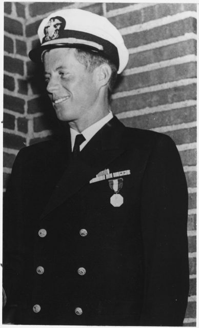Photograph of Lieutenant John Fitzgerald Kennedy in Navy uniform wearing Navy and Marine Corps Medal, Purple Heart