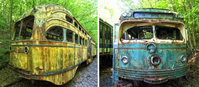 The PCC streamlined streetcars languishing in the woods are from Philadephia SEPTA and Boston MBTA.  Author: Forsaken Fotos, CC BY 2.0