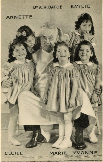 Allan Roy Dafoe with the Dionne quintuplets in 1938.