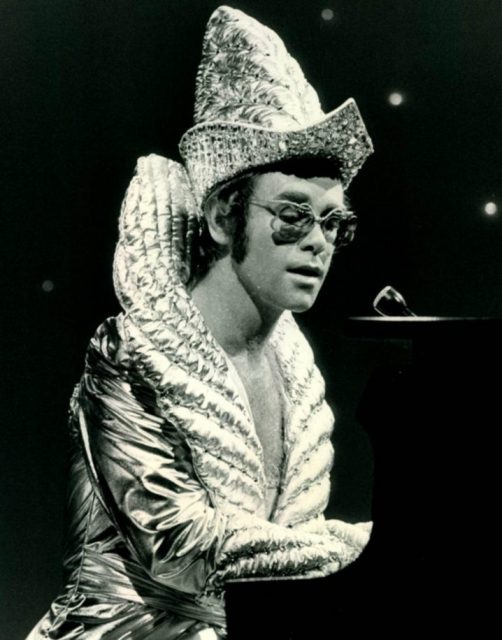 Publicity photo of Elton John from the Cher Show.