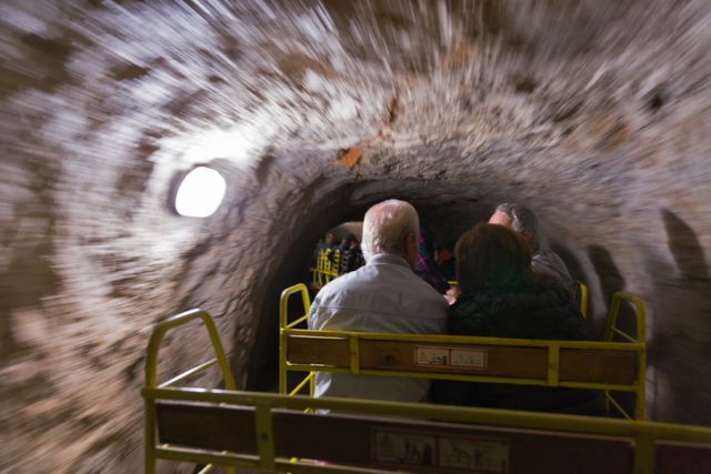Postojna, Slovenia – September 5, 2015: people travel by entertainment train in Postojna Cave.