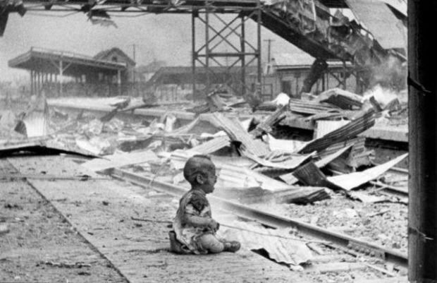 A baby crying at a bombed train station in Shanghai, 1937.