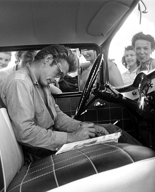 On location for Giant in Texas, James Dean signs autographs in a 1955 Chevrolet. Photo by Richard Miller.