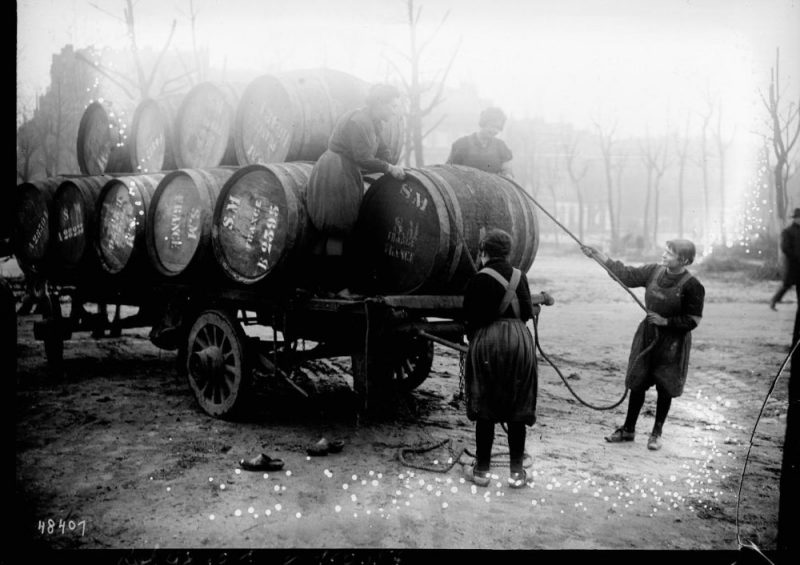 Women unloading barrels Bordeaux France