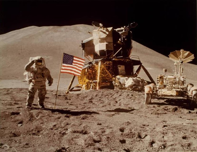 Astronaut James Irwin gives salute beside U.S. flag during lunar surface extravehicular activity (EVA), 