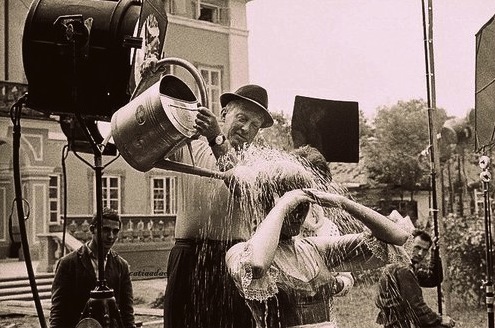 Julie Andrews is doused with water before her confrontational scene with Christopher Plummer during location shooting in Austria for The Sound of Music (1965).
