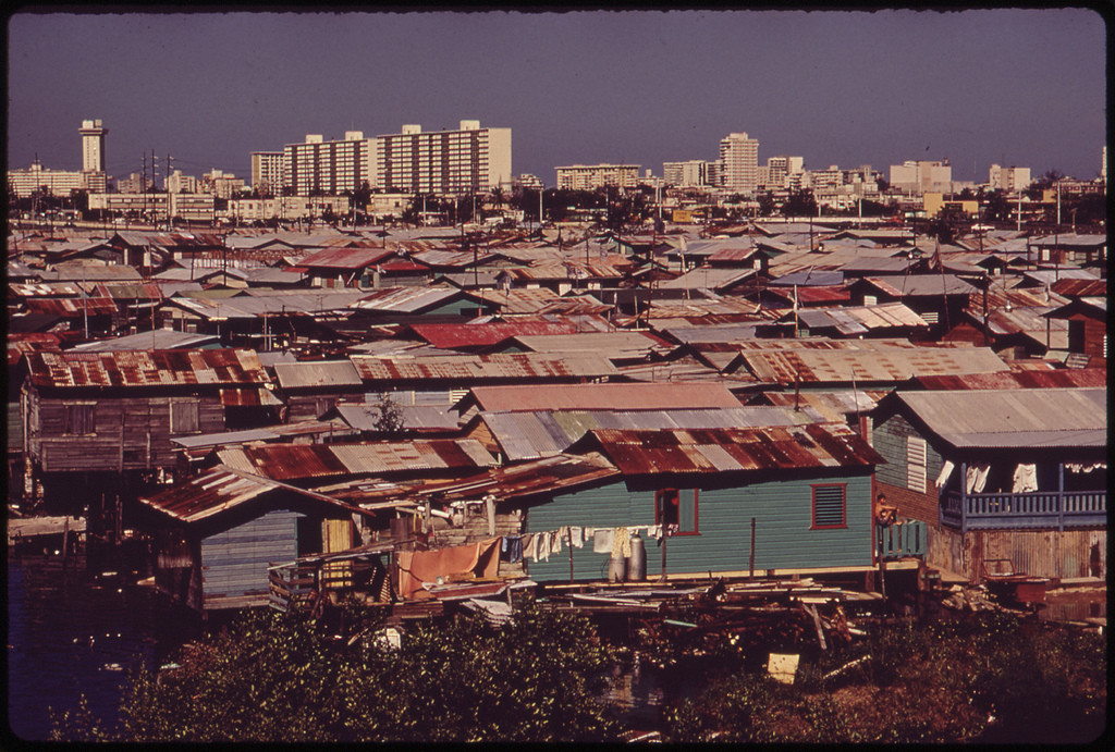 Modern-Buildings-Tower-over-the-Shanties-Crowded-Along-the-Martin-Pena-Canal-02.1973.j