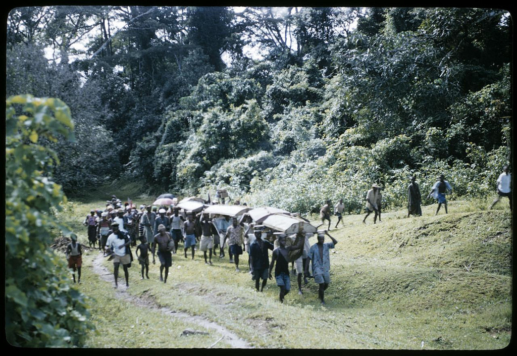 The D.C. entering Wozi on the Wuomee trail, Wozi, Liberia. William Gotwald Liberia mission slides, 1957-1960. ELCA Archives scan. http://www.elca.org/archives