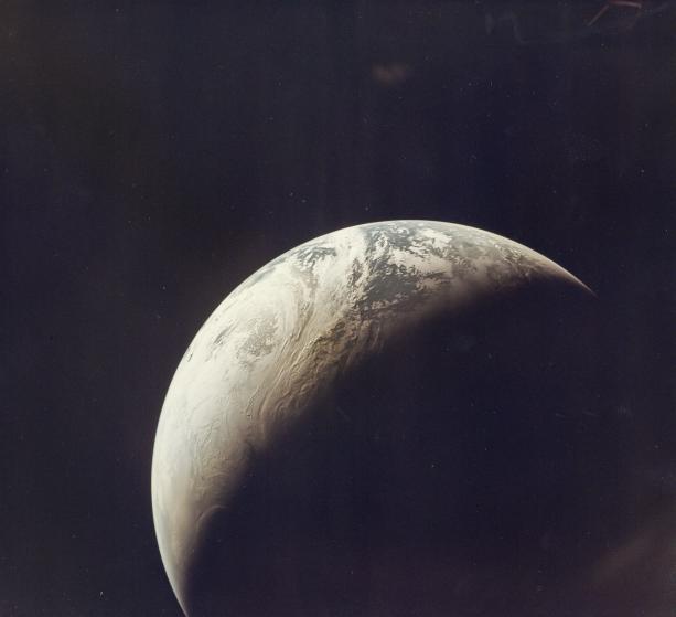 The first color photograph of the Crescent Earth taken aboard Apollo 4 in Nov. 1967. Photo © Bloomsbury Auctions