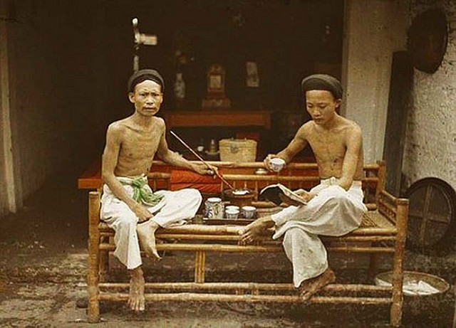 Tonkin - Hanoi Two opium smokers drinking tea, 1915
