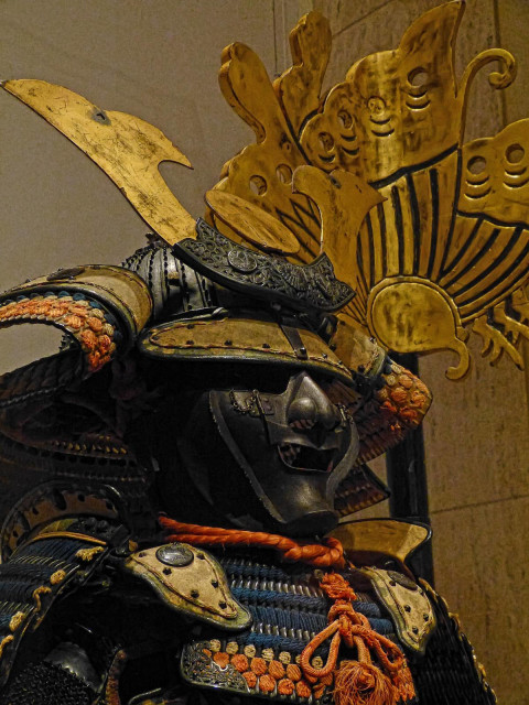 Closeup of the helmet and face mask of the Yokohagidō Armor with shakudō cuirass crafted from an alloy of copper and gold depicting a coiled dragon Helmet 14th century CE Armor 18th century CE Japan.