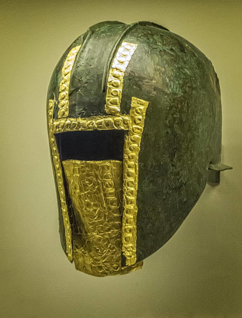 Funerary bronze helmet with gold mask from the necropolis at Archontiko Greek after 530 BCE. The gold mask has two heraldic lions surrounded by geometric and plant motifs representing the “king of the animals.”