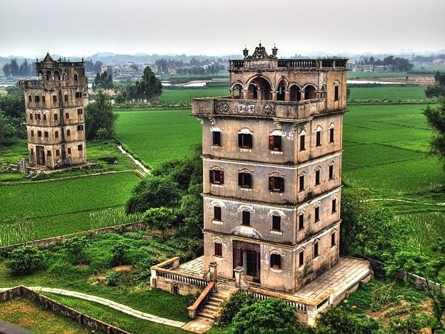 The Kaiping diaolou towers were built in a variety of architectural styles featuring a perfect combination of traditional Chinese watchtowers and classical European architecture. source