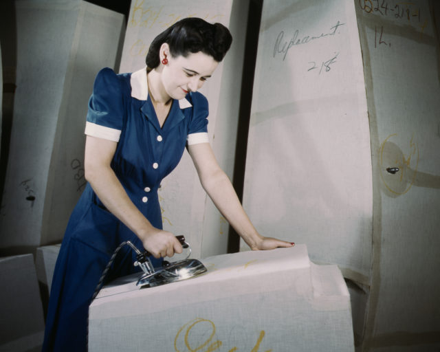 A worker irons at a factory for self-sealing gas tanks owned by the Goodyear Tire and Rubber Co. in Akron, Ohio.