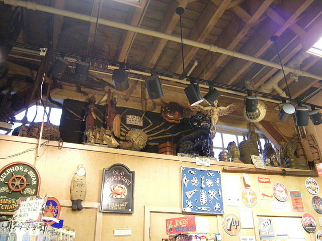 Miscellaneous objects in the rafters. Objects include a giant crab, some sculpture heads from China, and a Chinese dog statue, among other things. source