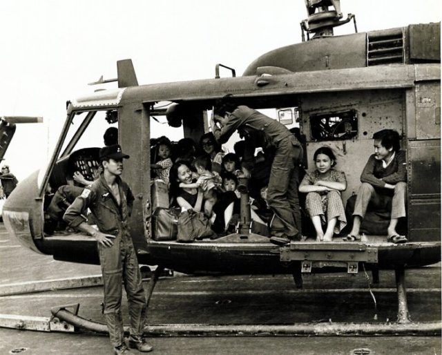 VNAF Huey full with evacuees on the deck of the USS Midway.Source